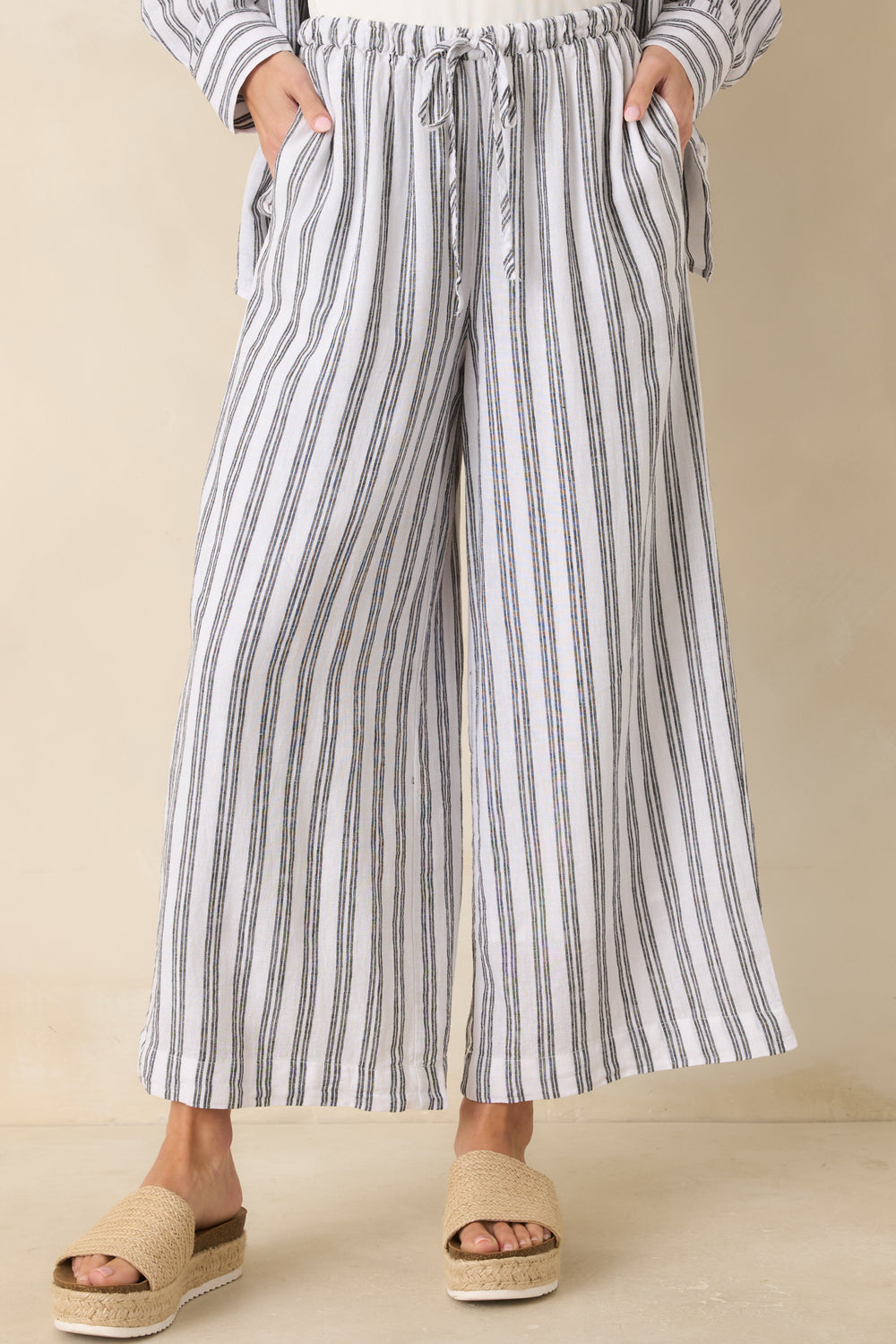 Cropped-View-Of-Striped-Pants-Focusing-On-The-Adjustable-Drawcord