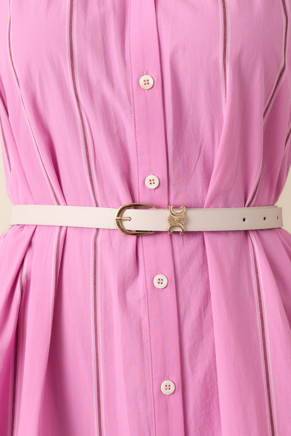 Detailed-Close-Up-Of-Ivory-Belt-Showcasing-Gold-Tone-Buckle