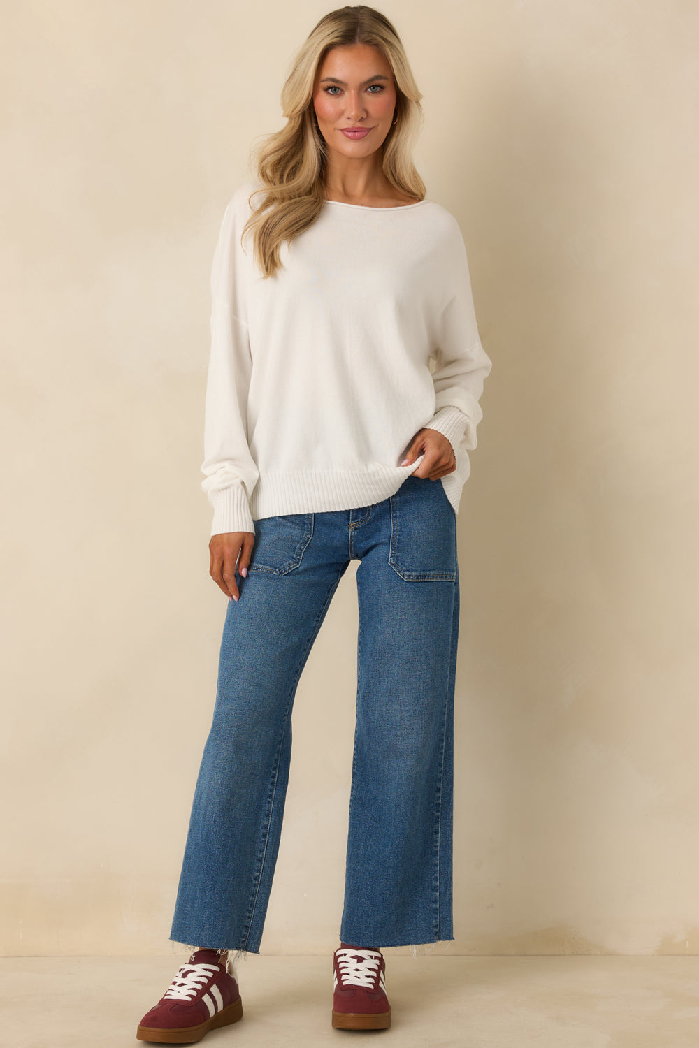 Front-View-Of-White-Knit-Sweater-Featuring-Scoop-Neckline