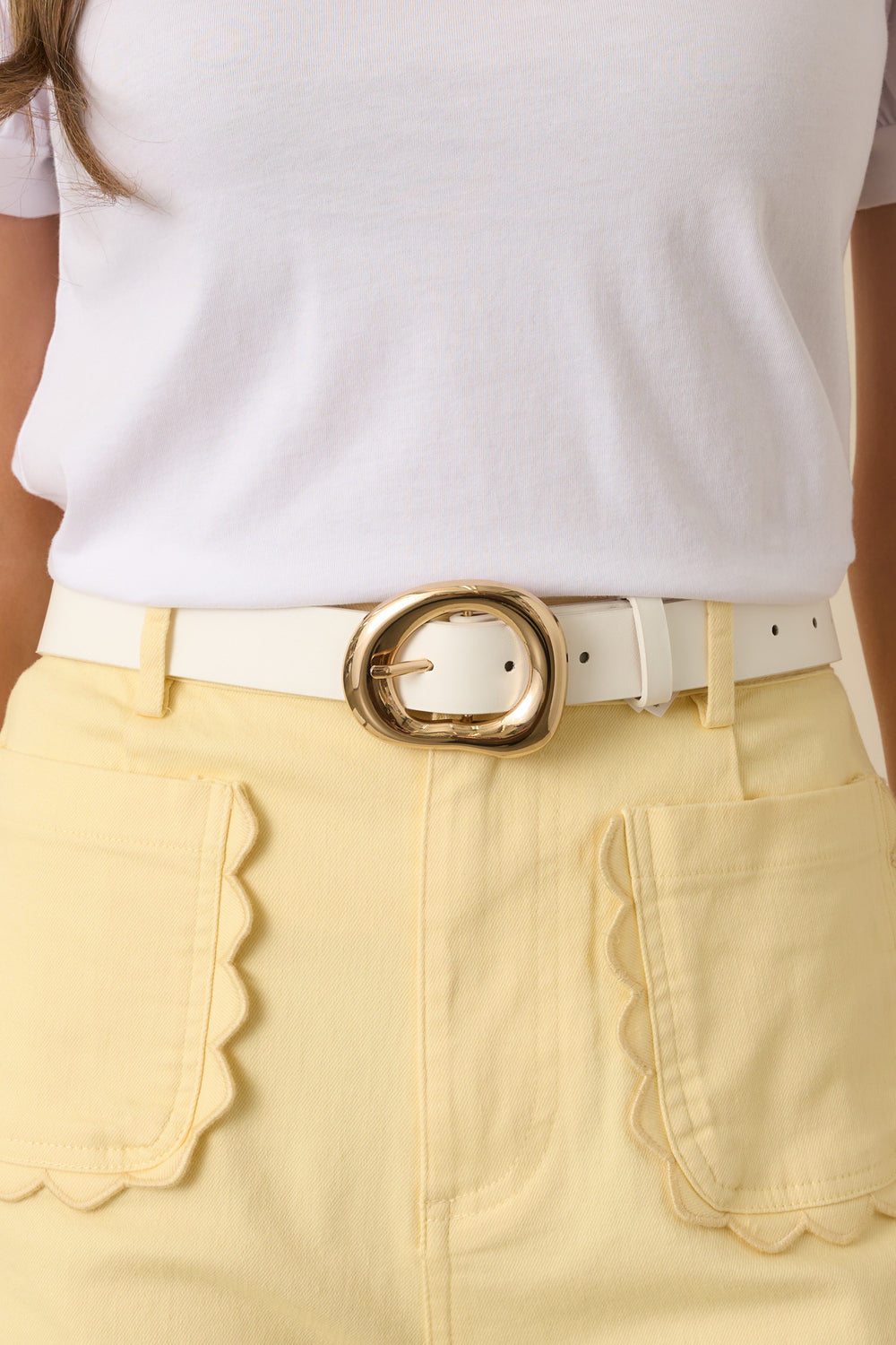 Hollow-Gold-Buckle-Paired-With-A-White-Faux-Leather-Strap
