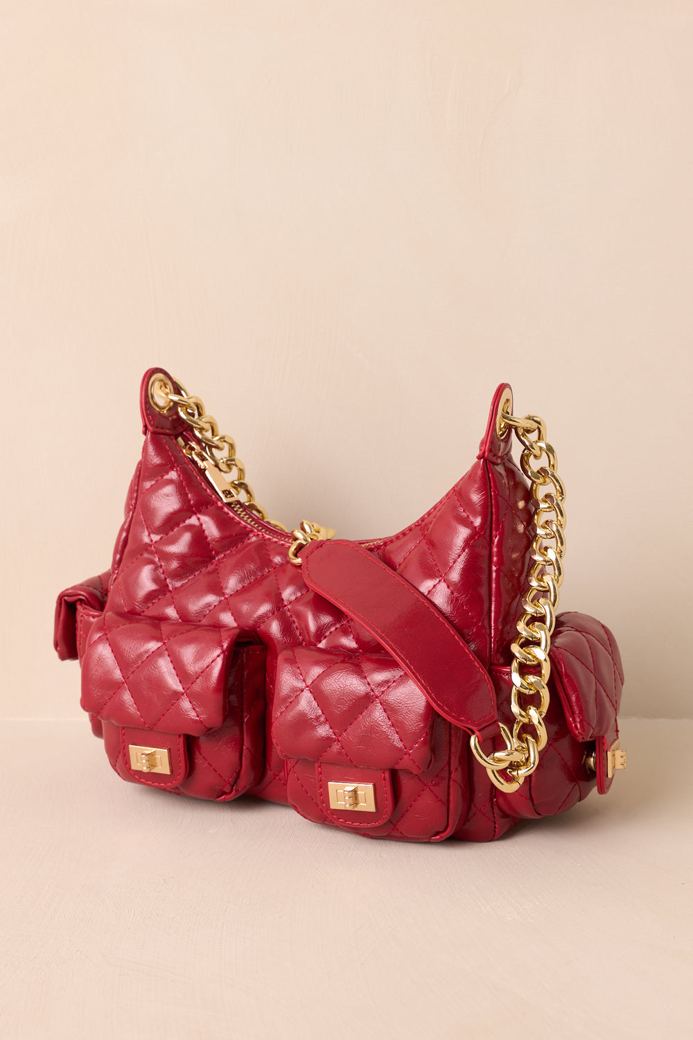 Red-Quilted-Handbag-Showing-The-Gold-Chain-Shoulder-Strap