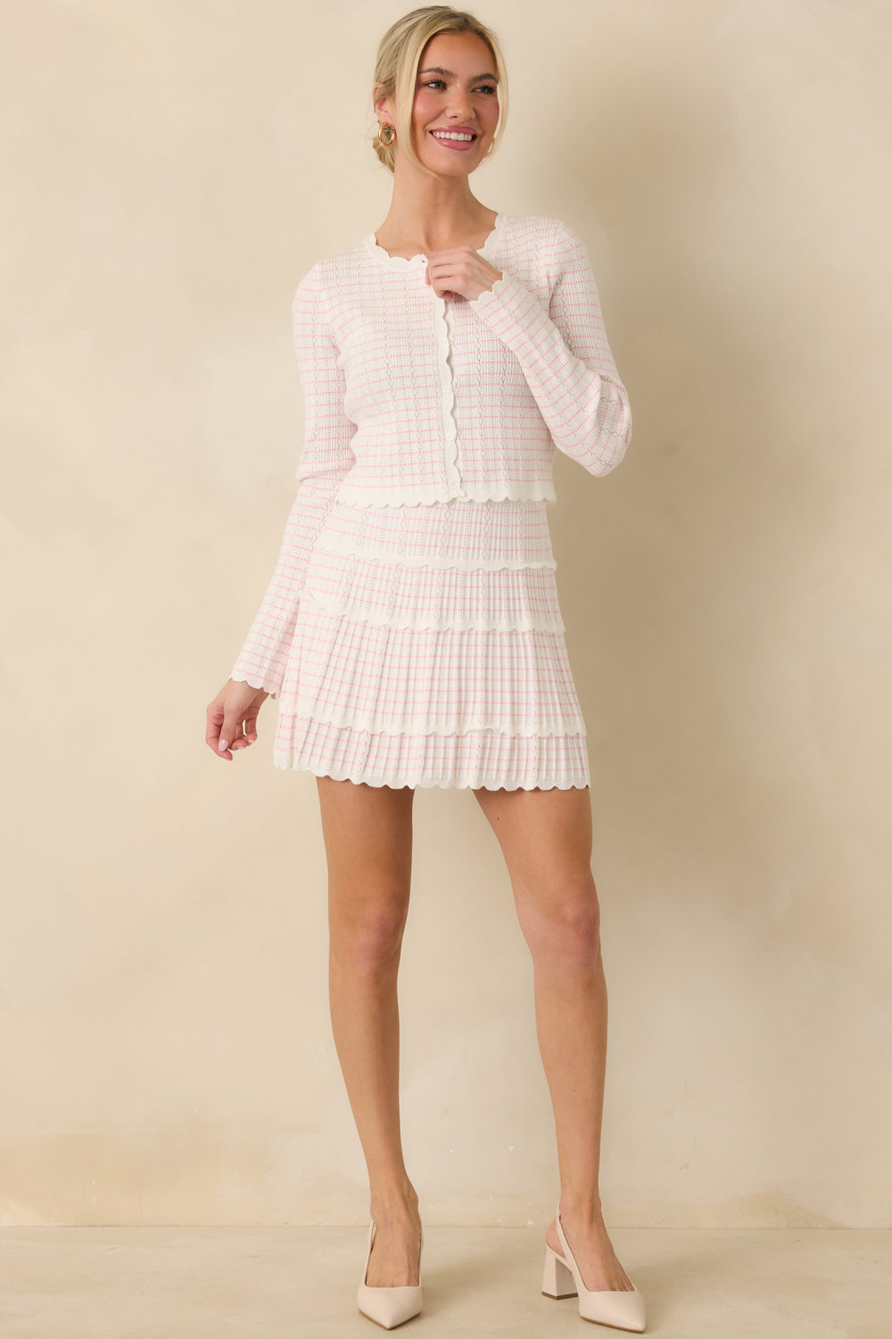 White-Cardigan-With-A-Pink-Stripe-Pattern-And-Round-Neckline